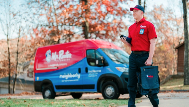 Mr. Rooter professional walking up to a customer's home.